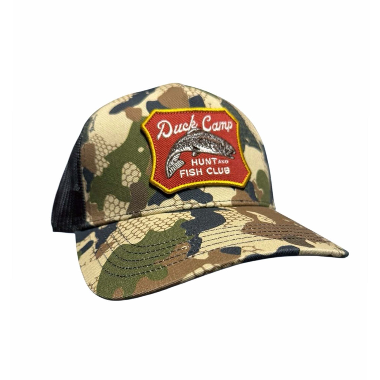 Camouflage cap with a red patch featuring 'Duck Camp Hunt and Fish Club' on a white background