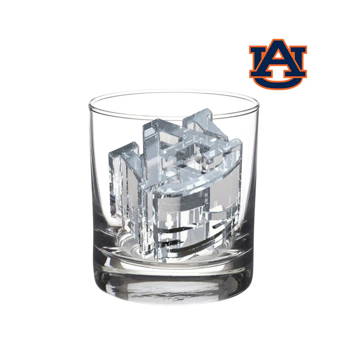 Oversized Auburn University logo ice cube inside a clear cocktail glass.