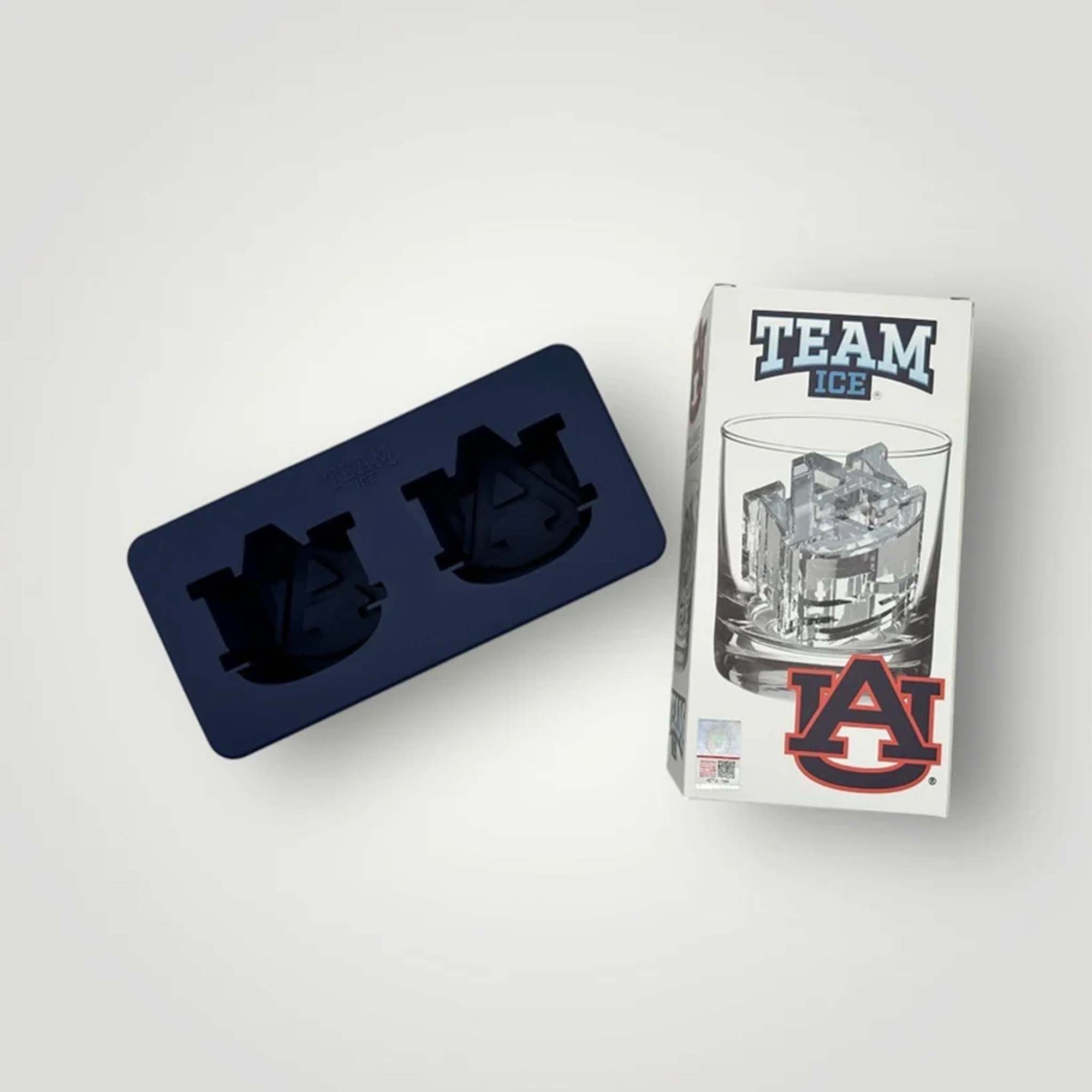 Navy silicone Auburn University ice mold with two logo cavities shown beside branded packaging.