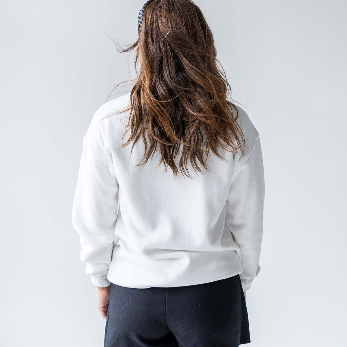 Back view of white Alabama crewneck sweatshirt without graphics.