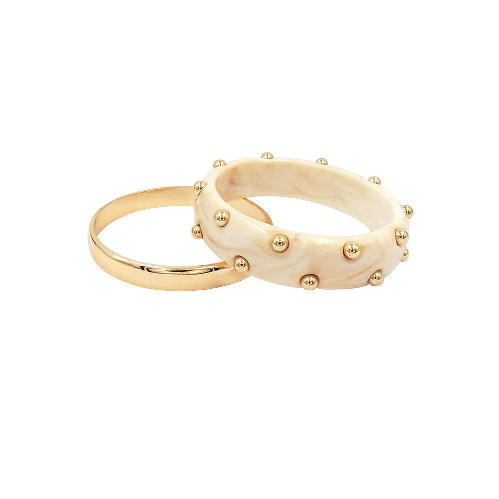 Two-piece bangle bracelet set featuring a smooth gold bangle and a marbled ivory bangle with gold stud accents displayed on a white background.