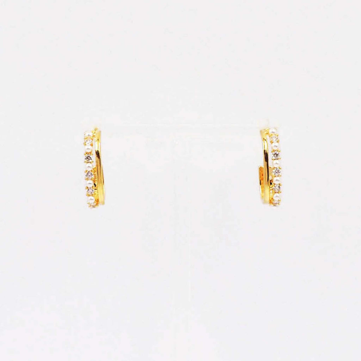 Gold huggie hoop earrings with full pave crystal and pearl detailing.