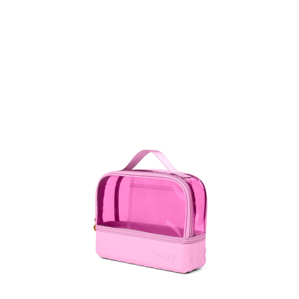 Pink transparent cosmetic bag with a handle on a white background by Bogg Bagg