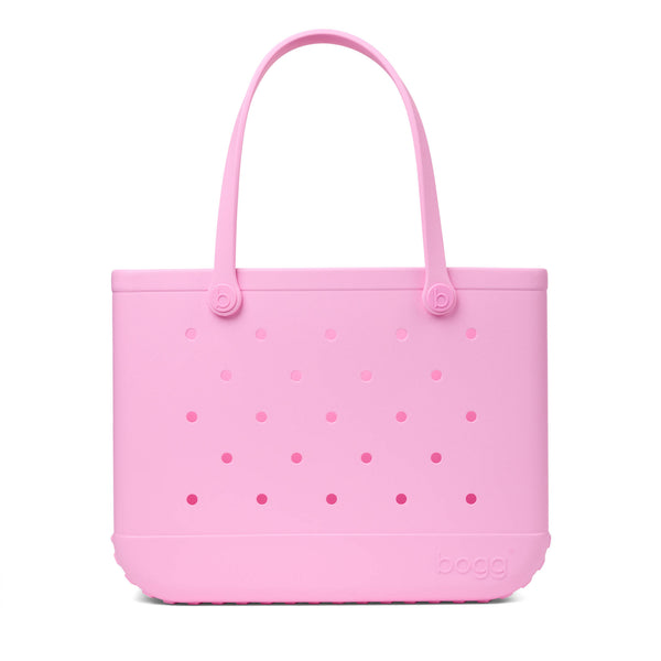 Pink Original Bogg Bag with handles raised shown in front of a white background.