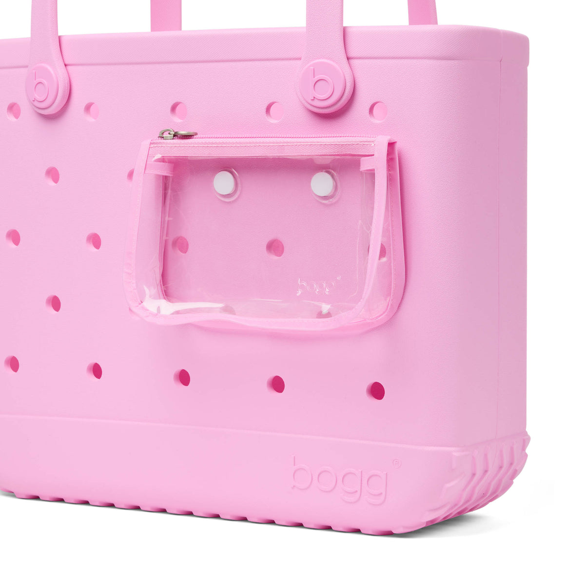 Close up of the Baby Bogg Bag in Pink Taffy focusing on the clear insert pouch attached to the side of the bag.