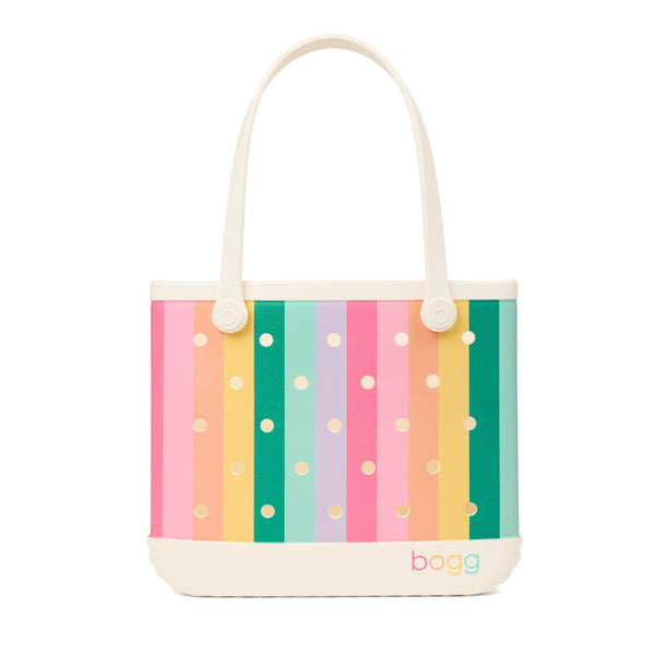 Bogg Baby Bag in Color Burst with pastel rainbow stripes, cream handles, and cream base with multicolor Bogg logo.
