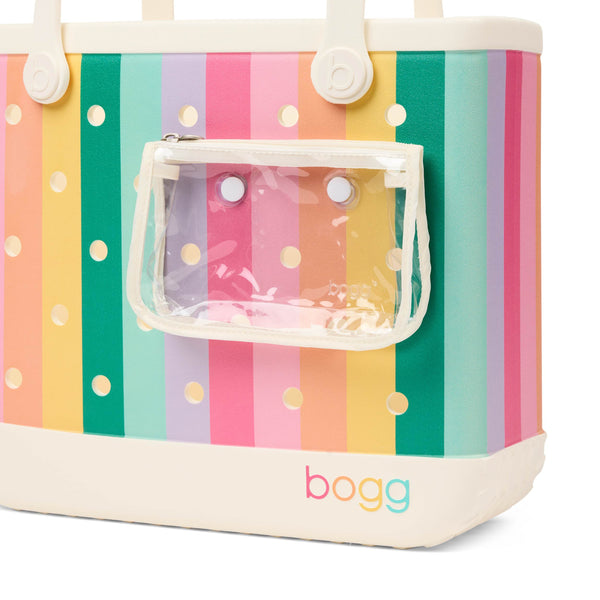Bogg Baby Bag in Color Burst with attached clear zippered pouch on front and pastel striped exterior.