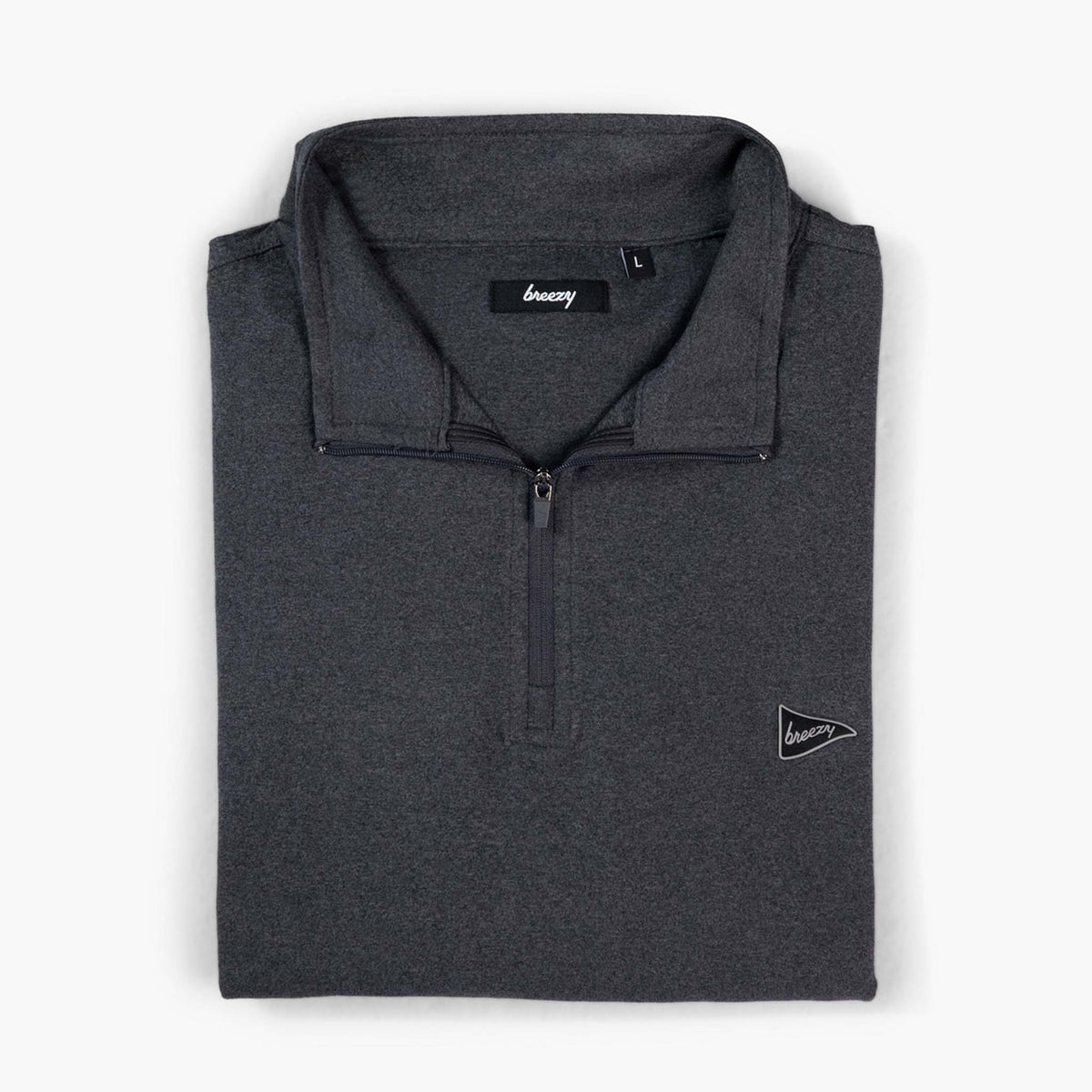 Front folded view of Breezy Quarter-Zip Pullover in charcoal with small pennant logo on chest.