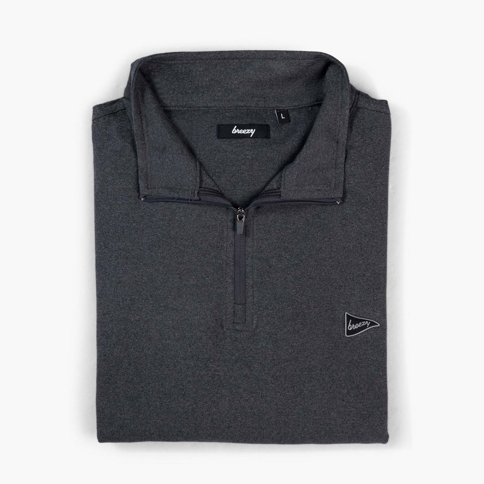 Front folded view of Breezy Quarter-Zip Pullover in charcoal with small pennant logo on chest.