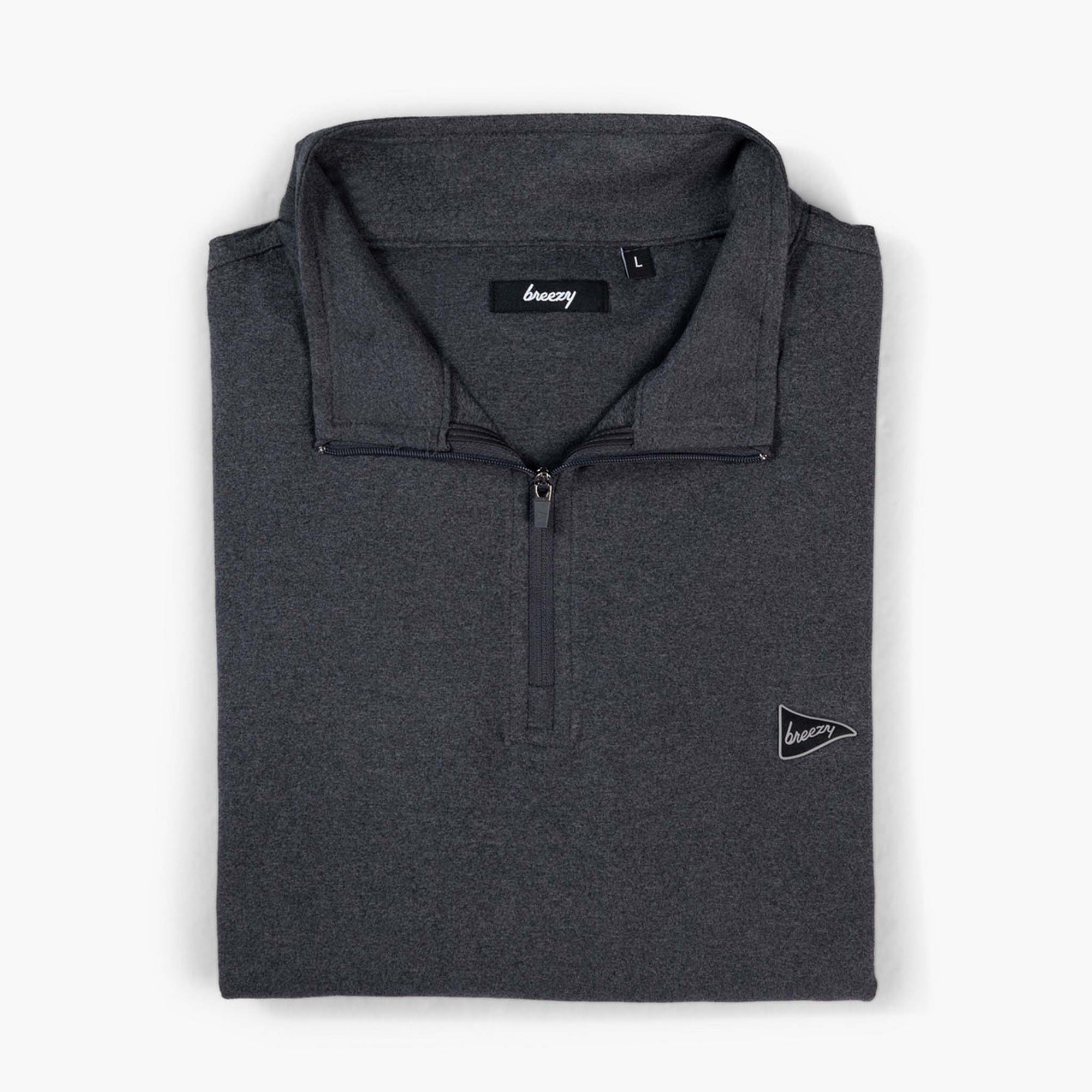 Front folded view of Breezy Quarter-Zip Pullover in charcoal with small pennant logo on chest.