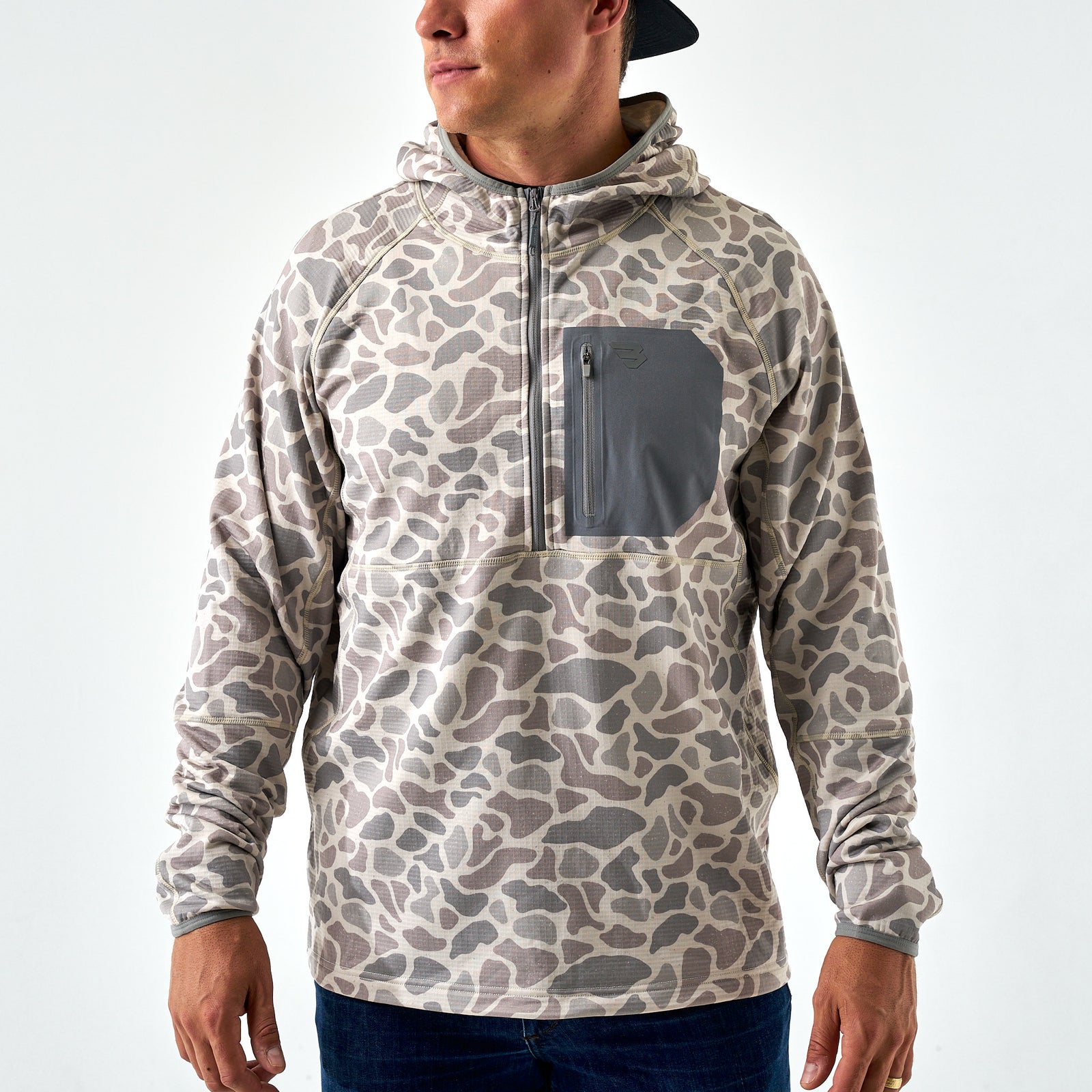 Front view of men’s camo quarter-zip hoodie in gray and taupe tones with contrast gray chest pocket.
