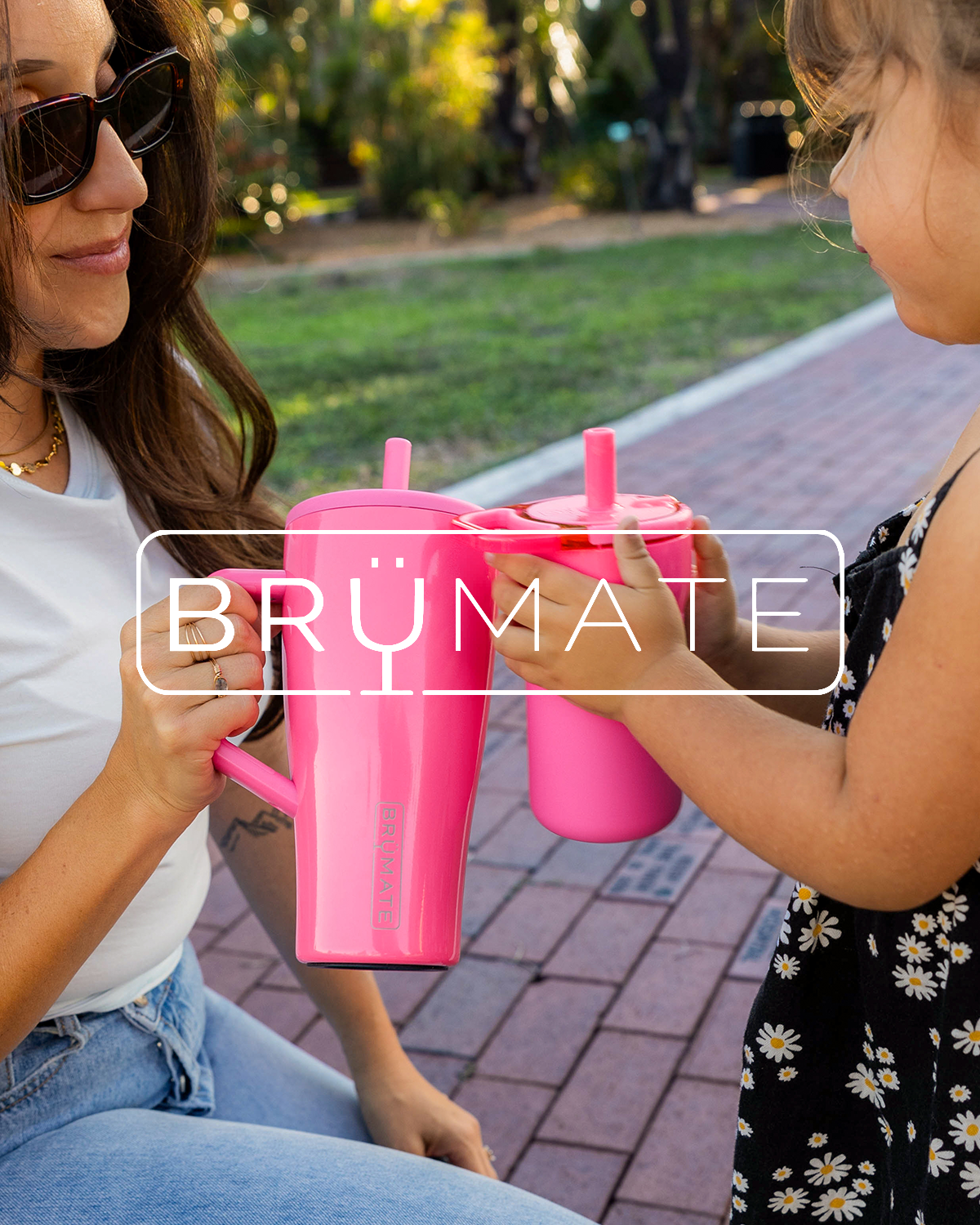 Mom and daughter holding matching BrüMate tumblers.