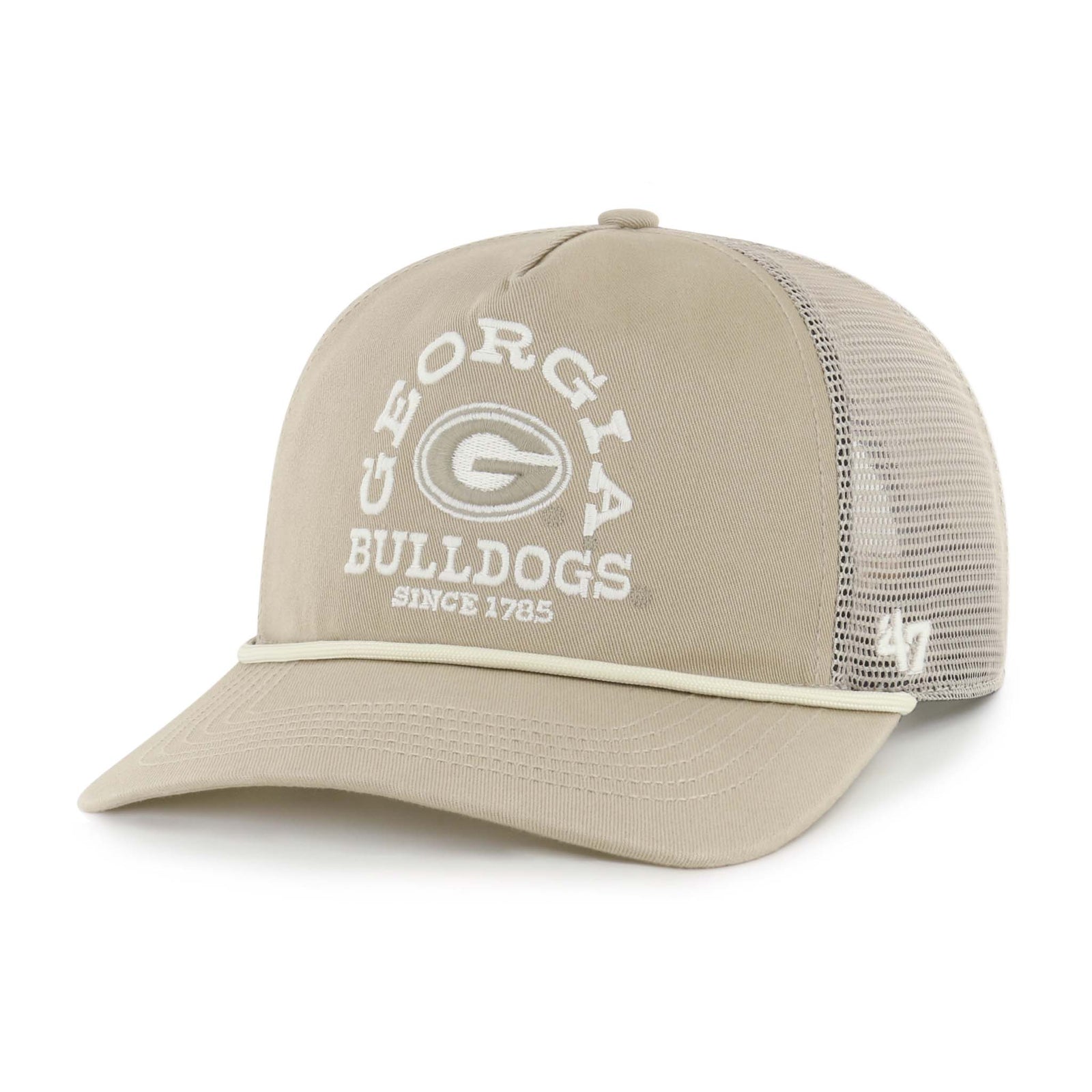 A khaki trucker-style baseball cap with a matching mesh back and adjustable snap closure. The front features arched white embroidered text reading “GEORGIA” above a white “G” logo, with “BULLDOGS” and “SINCE 1785” stitched below. A khaki rope detail runs across the base of the curved brim, and a white '47 logo is embroidered on the side of the mesh panel.