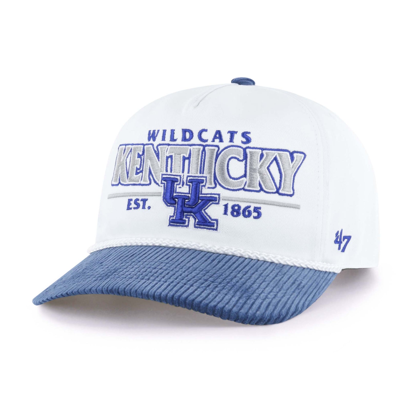 A white and blue baseball cap featuring embroidered text and graphics for the University of Kentucky Wildcats. The front displays the word “KENTUCKY” in large gray letters outlined in blue, with a blue "UK" logo underneath and the words “WILDCATS” and “EST. 1865” in smaller blue text above and below. The bill is made of blue corduroy fabric, and a white rope trim runs along the base of the crown. A blue '47 logo is stitched on the side. The hat is shown against a plain white background.