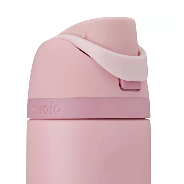 Close-up of the Owala FreeSip lid in Rose Quartz showing the carry loop snapped down. 