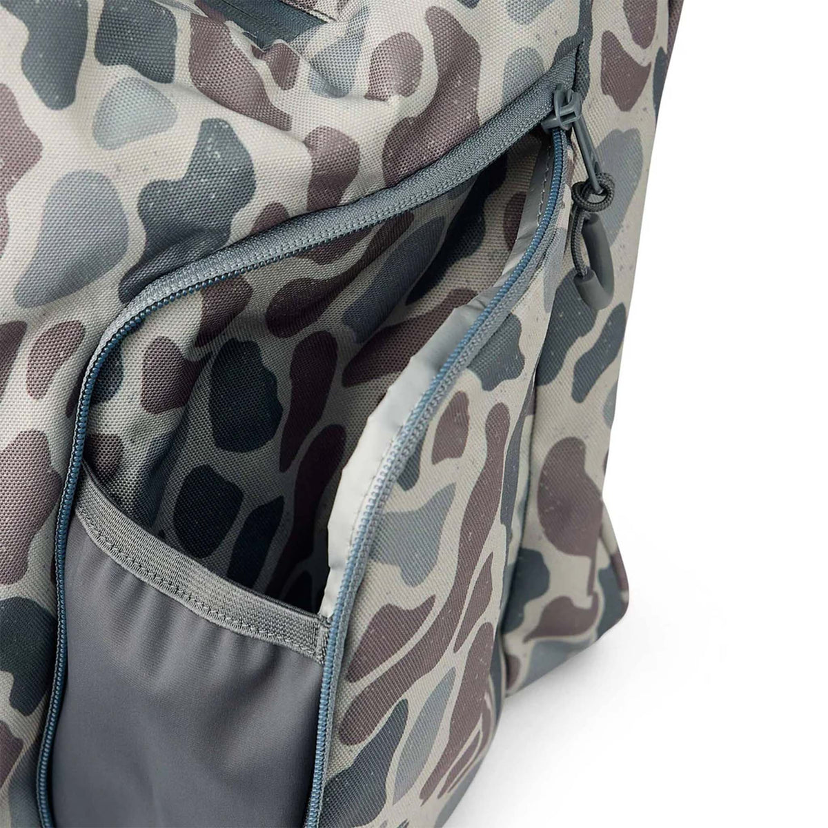 Side view of BURLEBO camo cooler bag showing zippered side pocket and durable stitched trim detail.