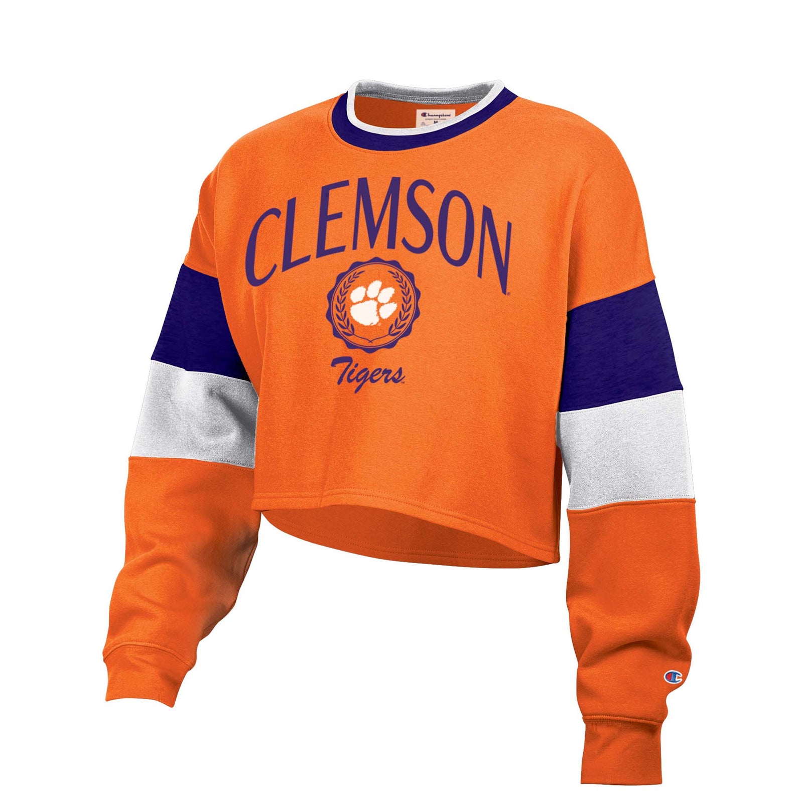 Clemson adult cropped crewneck sweatshirt in orange with bold “Clemson” wordmark, paw logo, and colorblock sleeves in purple, white, and orange.