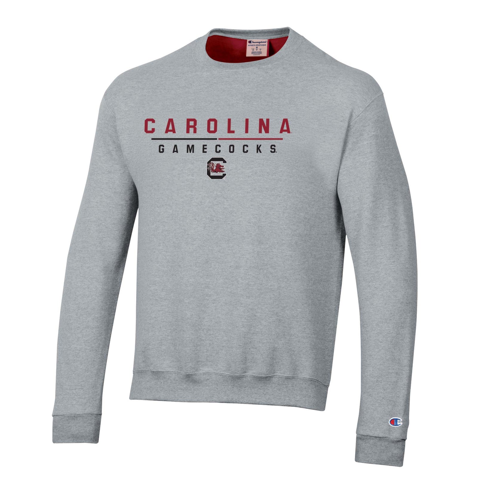 Grey Champion crewneck sweatshirt with “Carolina Gamecocks” text and Gamecocks logo, finished with Champion “C” logo on sleeve.