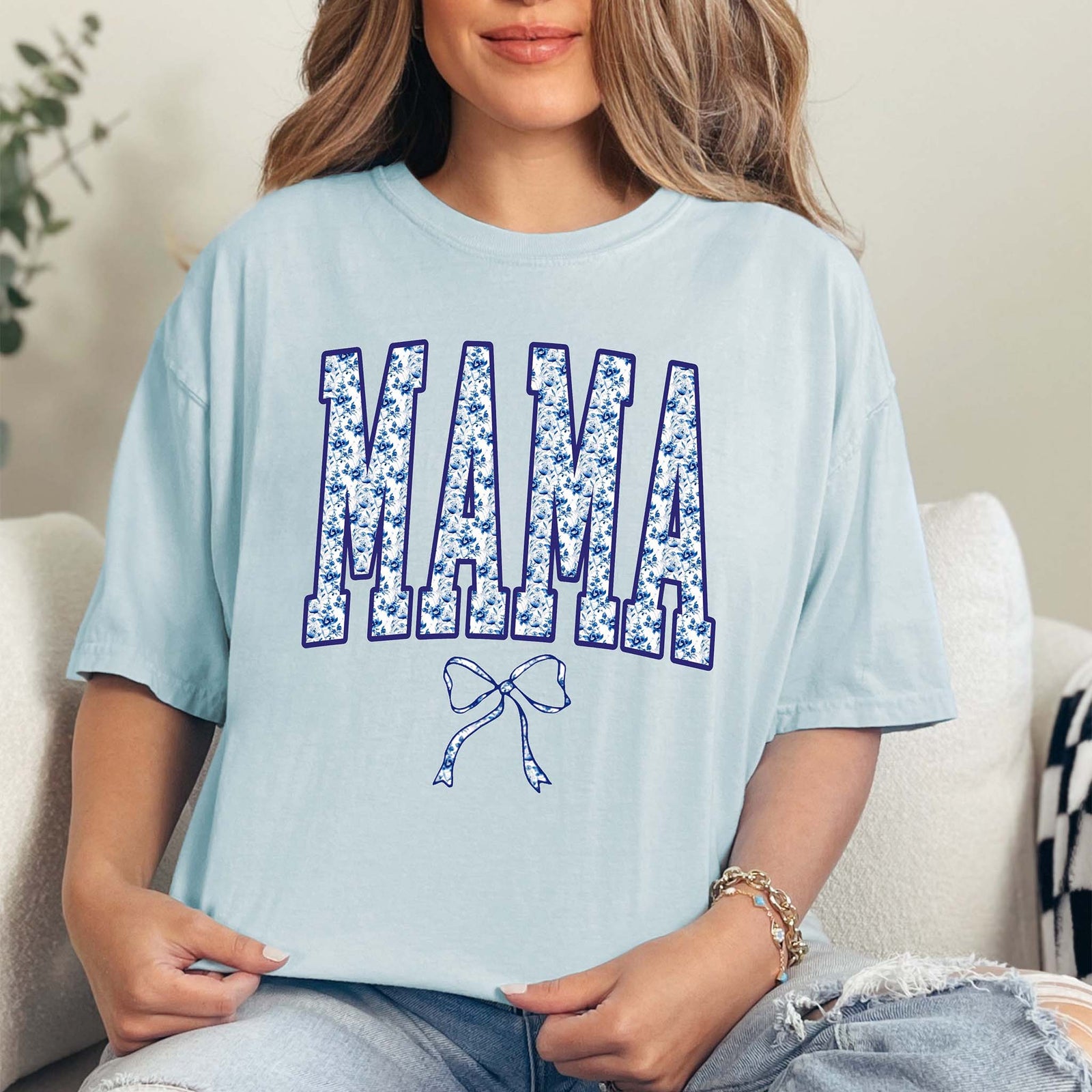 Floral Mama Graphic T-Shirt – A soft cotton tee featuring the word 'Mama' in bold, stylish lettering, filled with a vibrant floral pattern. Comfortable fit with a classic crew neckline, perfect for Mother's Day or everyday wear.