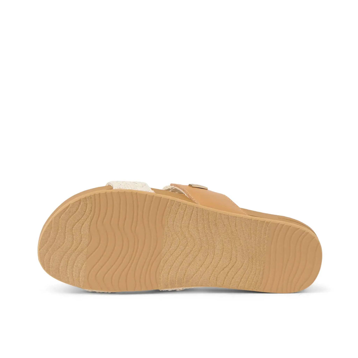 Tan sandal sole with textured bottom on a white background