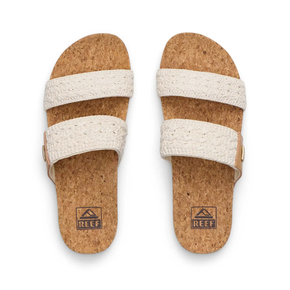 Pair of cork sandals with white straps on a white background, featuring the Reef logo.