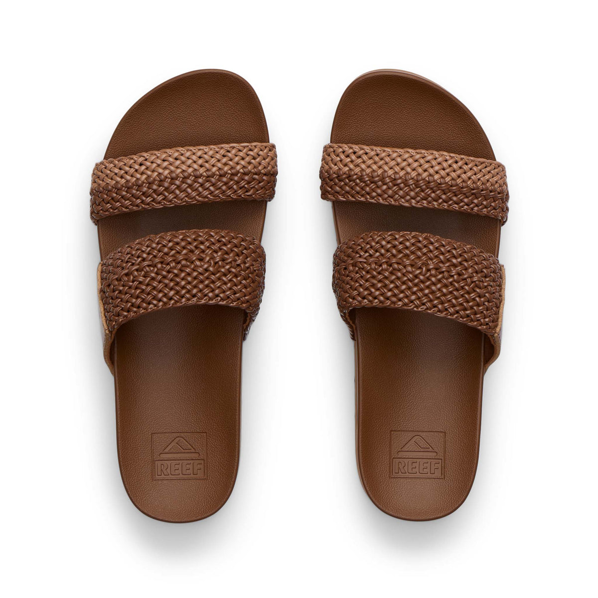 Pair of brown sandals with woven straps on a white background