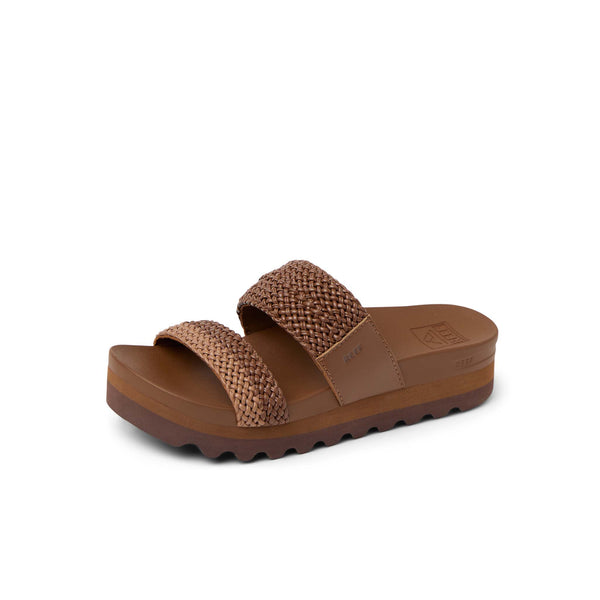 Brown sandal with textured straps on a white background