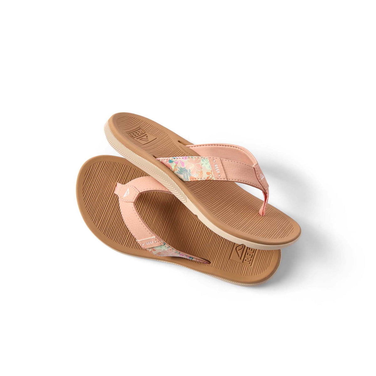 Pair of tan flip-flops with pink straps on a white background