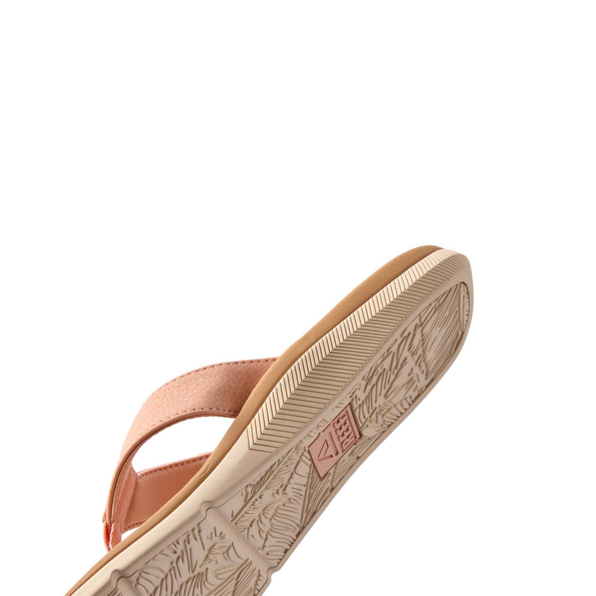 Close-up of a sandal sole with brand logo on a white background