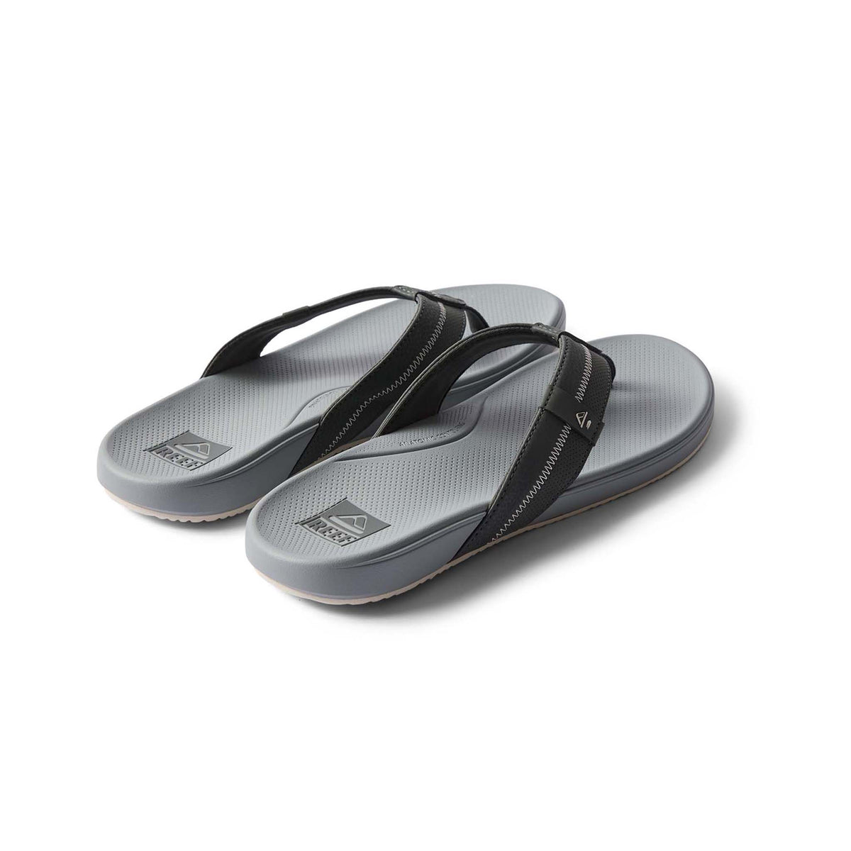 Pair of gray sandals with black straps on a white background