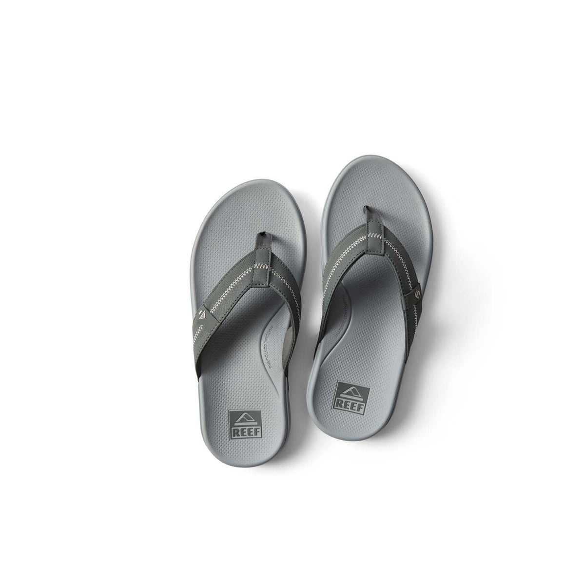 Pair of gray flip-flops on a white background