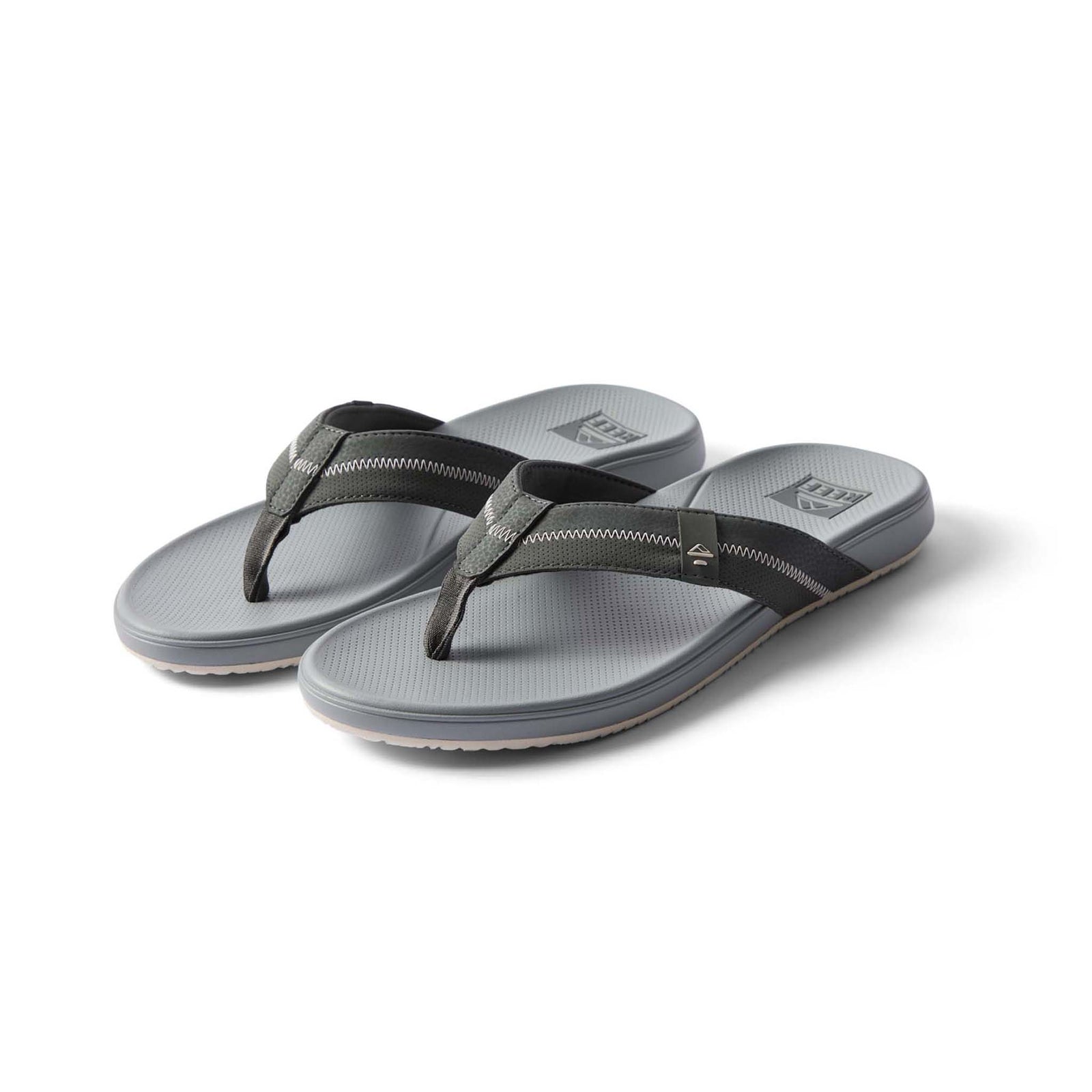 Pair of gray and black sandals on a white background