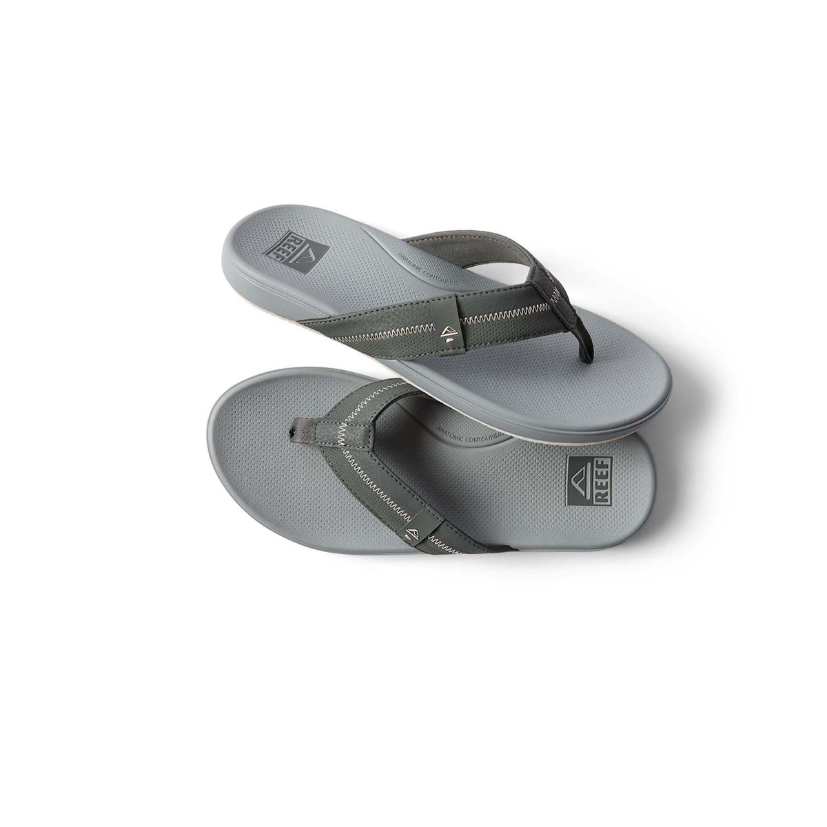 Pair of gray sandals with black straps on a white background