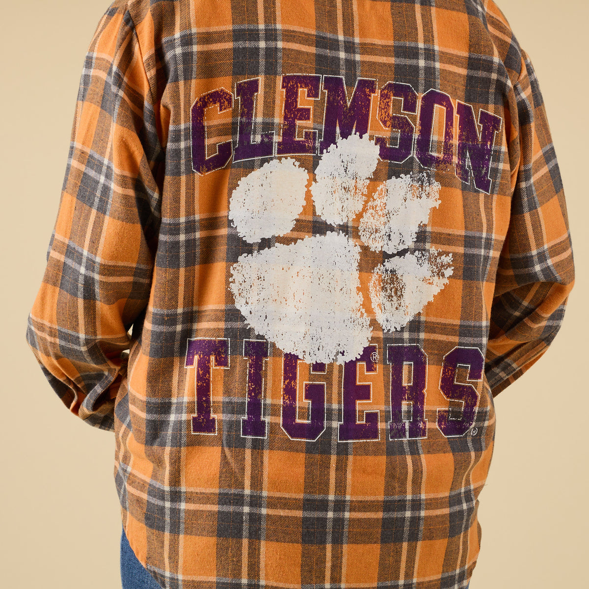 Plaid shirt with Clemson Tigers logo on a beige background
