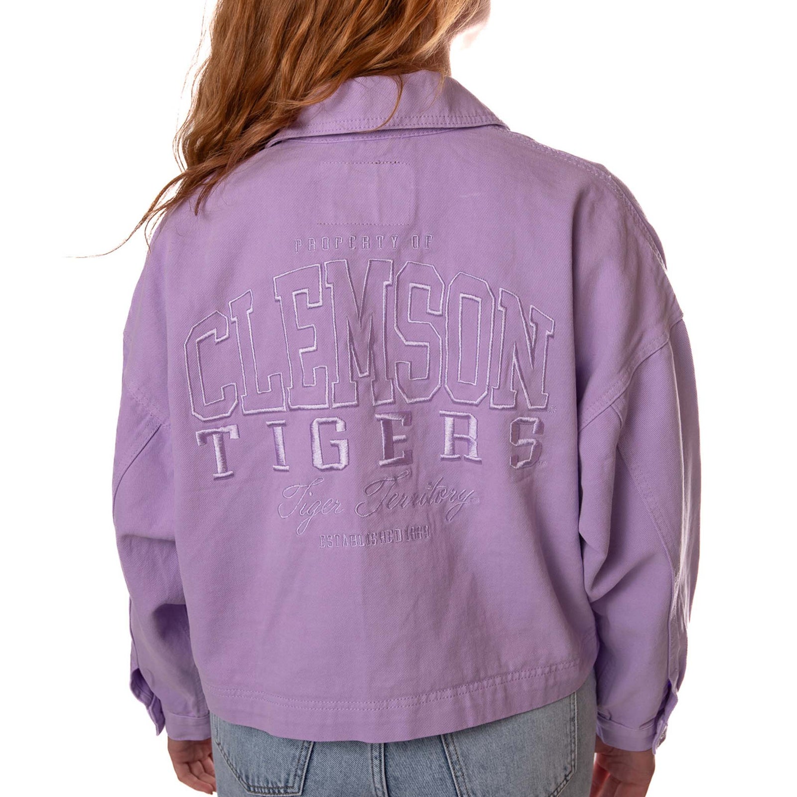 Back view of lavender Clemson twill jacket with large embroidered “Clemson Tigers” lettering.