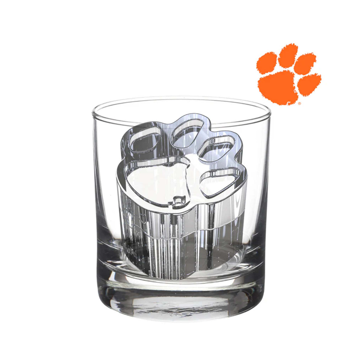 Clear Clemson University tiger paw-shaped ice cube sitting inside a cocktail glass.