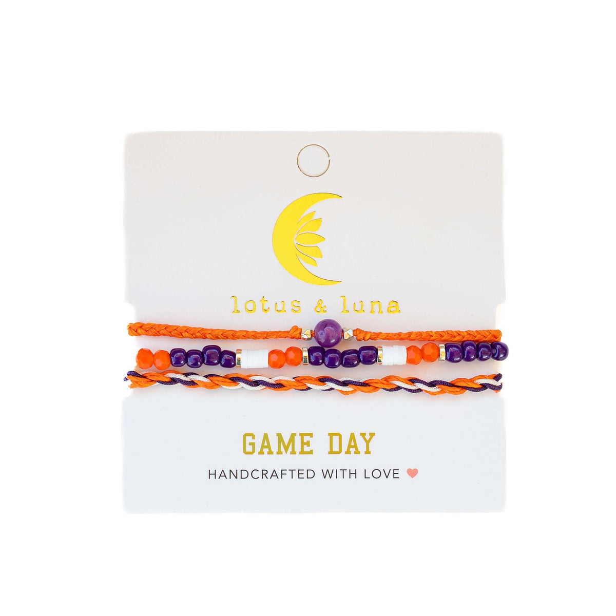 Lotus & Luna Game Day bracelet set in orange and purple with beaded and braided styles on a branded card.