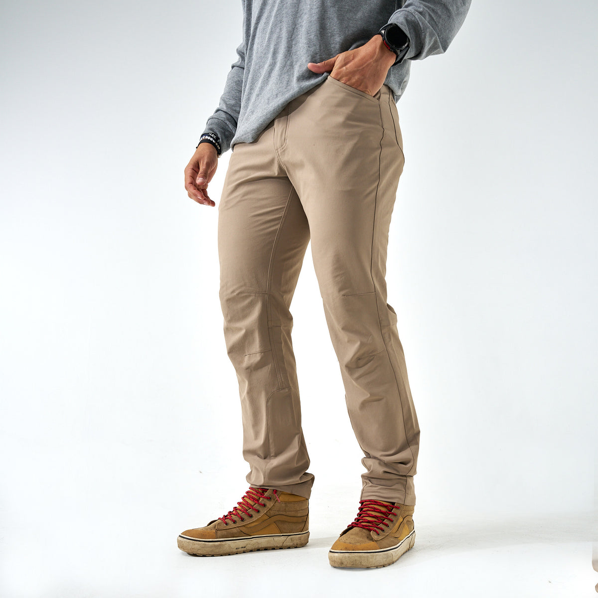Burlebo Challenger Pants in cobblestone khaki shown full length with tan sneakers, styled with a gray long sleeve shirt.