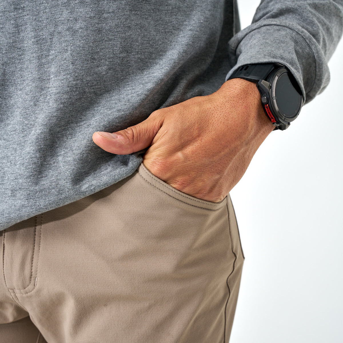 Close-up side view of Burlebo Challenger Pants in cobblestone khaki showing hand in front pocket.