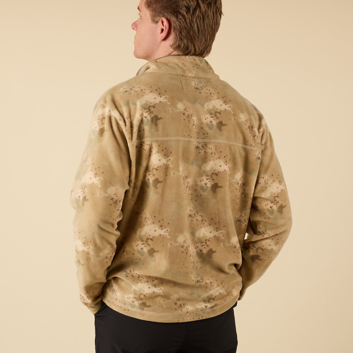 Back view of the Crosby Fleece Quarter Snap Pullover in tan camo showing relaxed fit and soft fleece texture.
