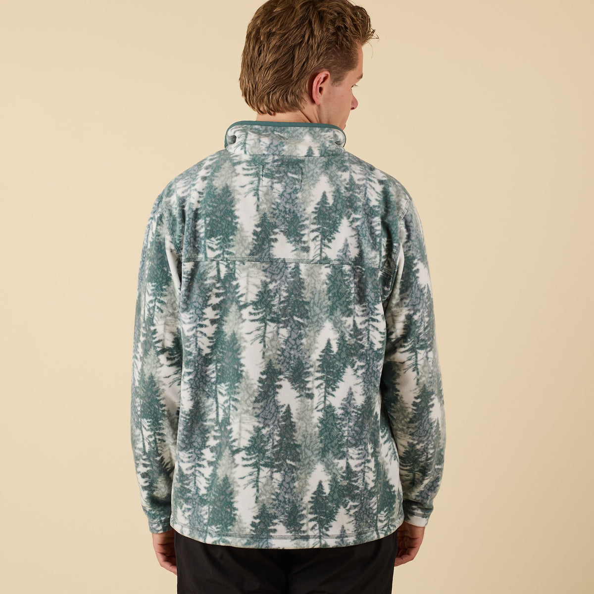 Back view of Crosby Fleece Quarter Snap Pullover featuring full spruce tree forest print and relaxed fit.