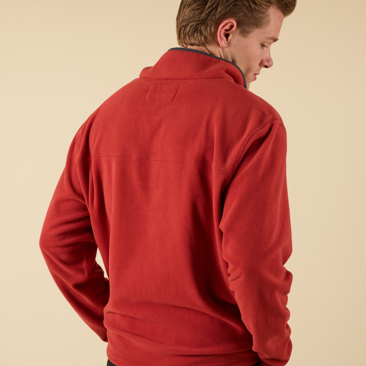 Back view of Crosby Fleece Quarter Snap Pullover in red showing smooth fleece texture and relaxed fit.