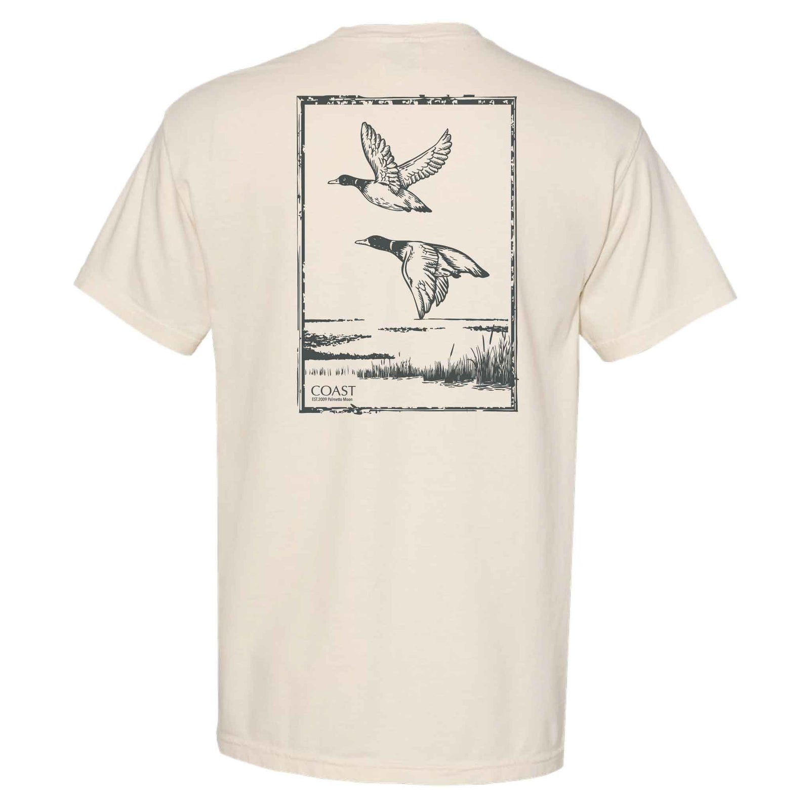 Back of COAST ivory t-shirt featuring illustration of two ducks flying over marsh grass and water framed in a rectangular graphic.