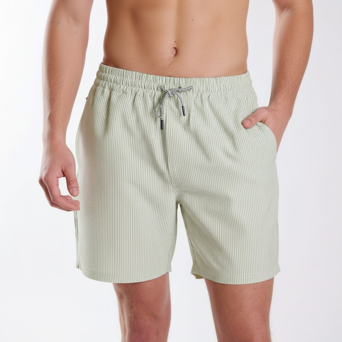 Light green striped shorts worn by a person on a white background