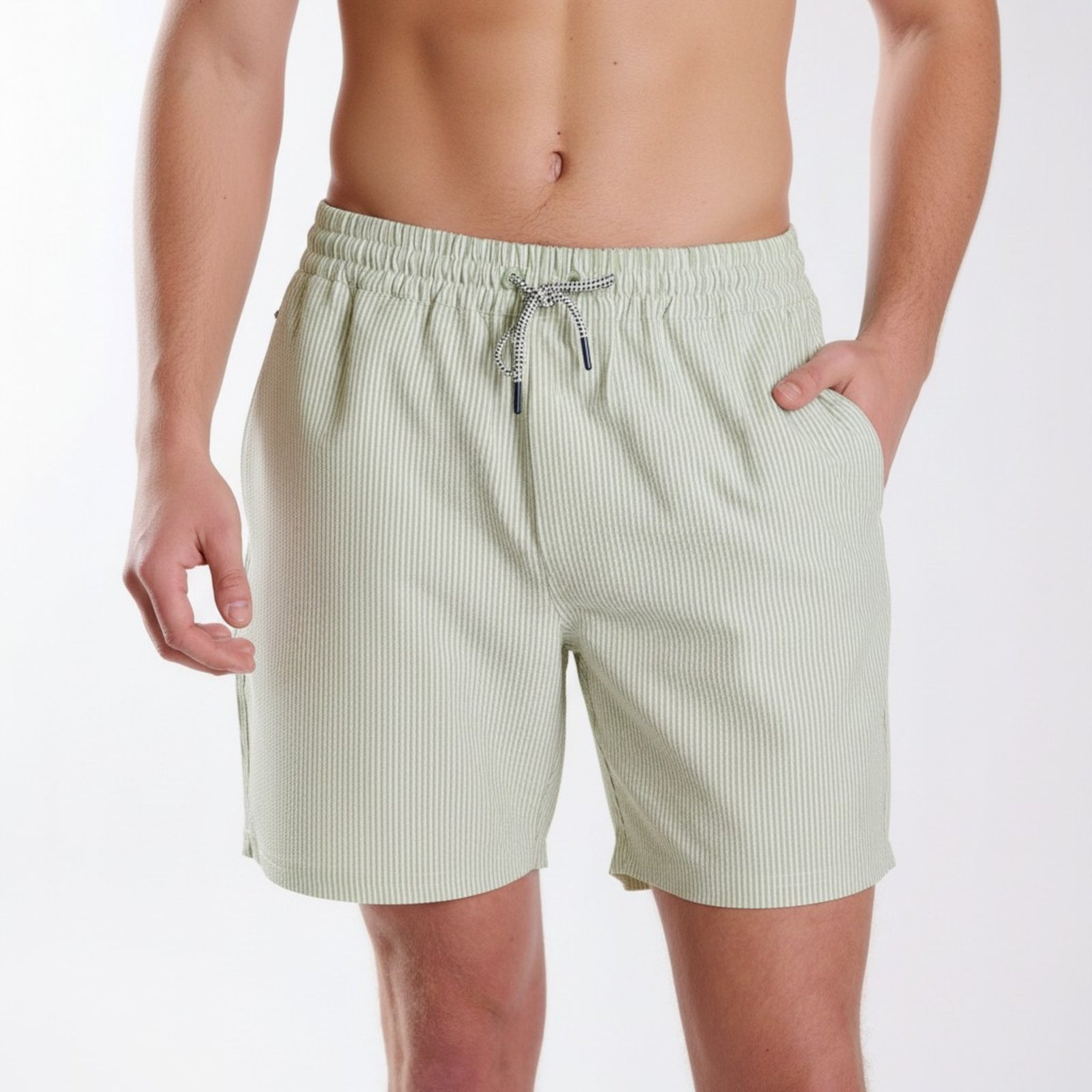 Light green striped shorts worn by a person on a white background