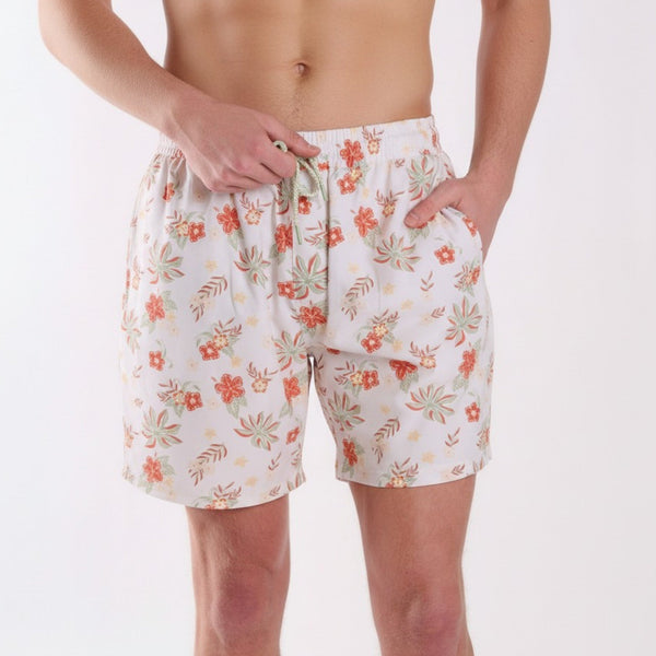COAST vintage tropical swim shorts with ivory base and coral floral print, shown from the front with elastic drawstring waistband.