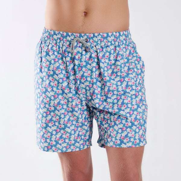COAST azalea printed volley swim shorts with blue background and pink and white floral pattern, shown from the front with elastic drawstring waistband.