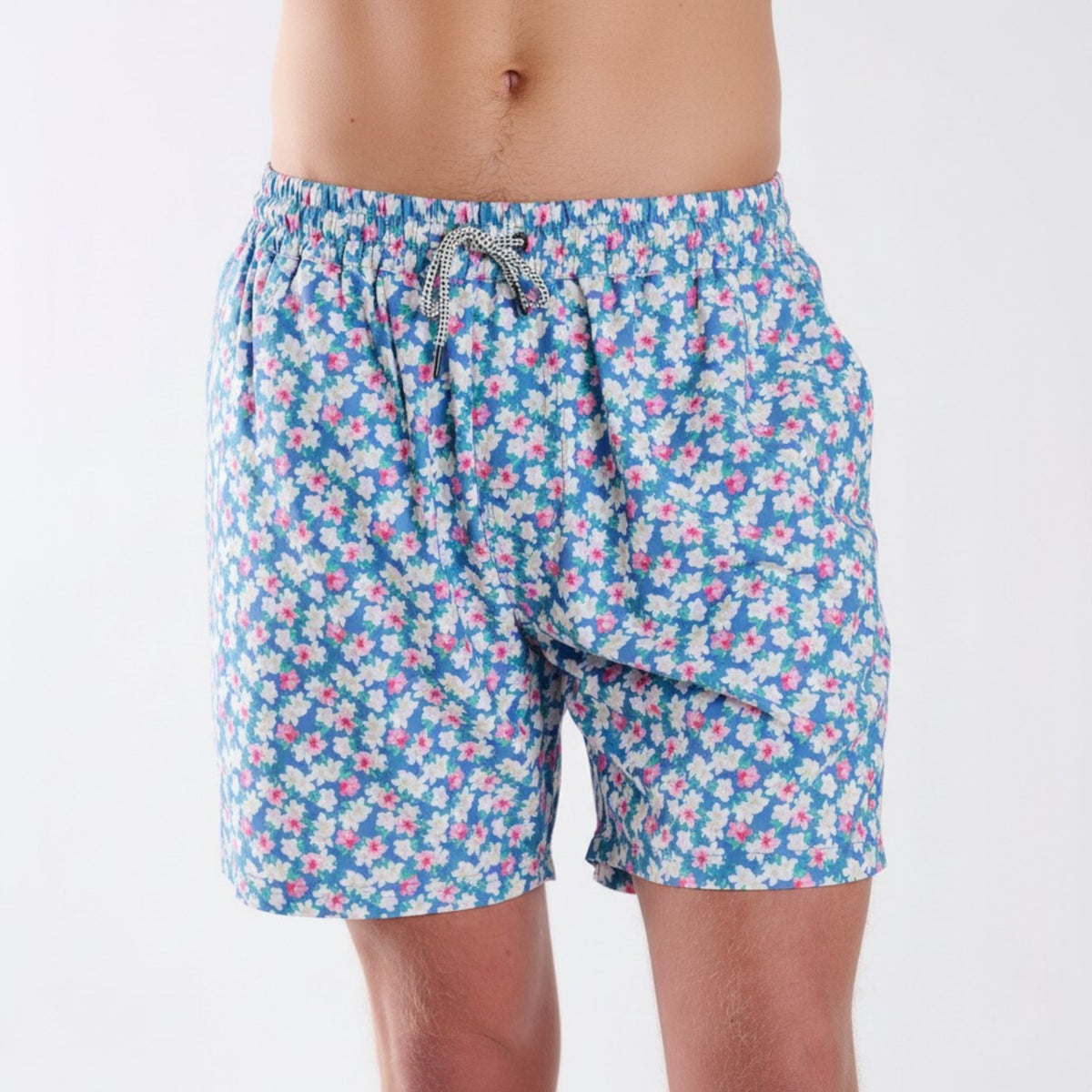 COAST azalea printed volley swim shorts with blue background and pink and white floral pattern, shown from the front with elastic drawstring waistband.