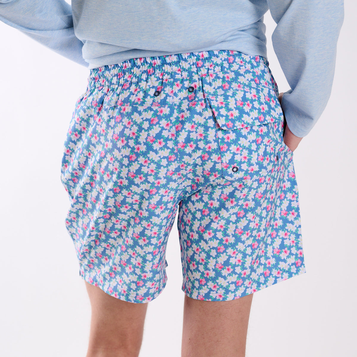 Side view of COAST azalea printed volley swim shorts with blue floral print showing side pocket and relaxed volley fit.