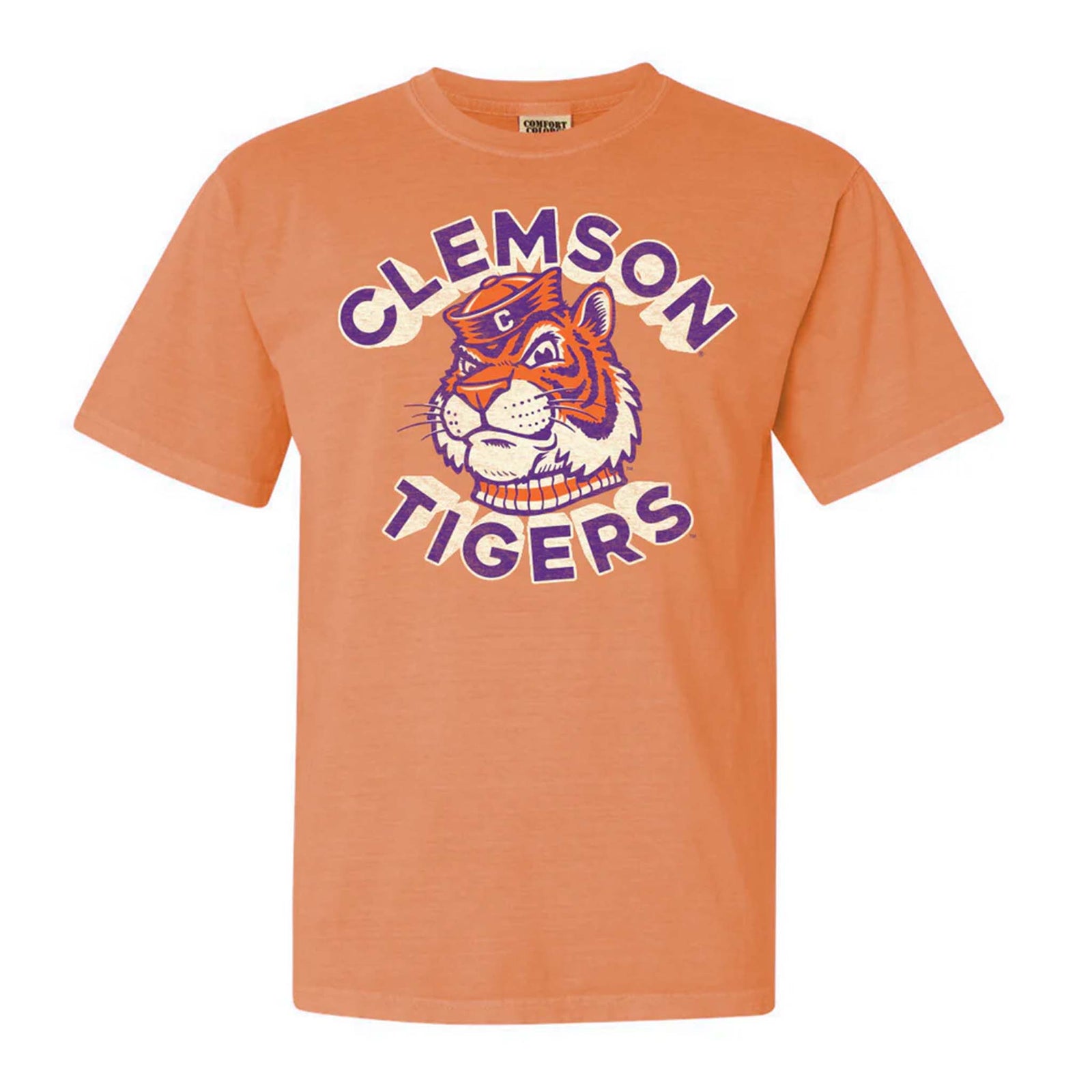 Retro Clemson Tigers t-shirt in melon orange with a vintage-style tiger mascot graphic and bold “Clemson Tigers” text in purple and cream on the front.